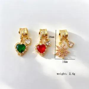 Detailed shot of copper gold-plated micro-paved cubic zirconia heart and star pendant charms.