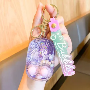 Porte-clés jeu d'eau liquide licorne mignon, pendentif de sac à main transparent jouet.