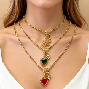Detailed view of layered gold-tone chain necklace with sparkling zircon heart and starburst charms.