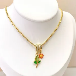 Gold-plated brass necklace featuring a sparkling cubic zirconia tulip and daisy pendant.