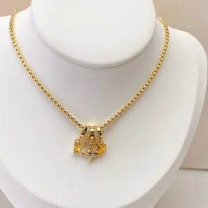 Detailed view of gold plated multi-layer tube bead heart zircon star DIY necklace pendant.