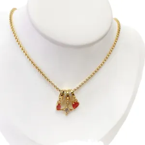 Gold tubular chain necklace with crystal star and red heart charms elegant fashion jewelry