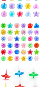 Colorful acrylic finger spinner toy details, showing various flower and dolphin shapes clearly.