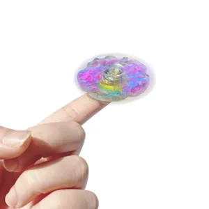 Colorful iridescent wave fidget spinner detail shot, glowing laser texture stress relief toy.