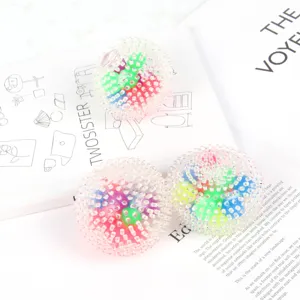 Detail shot of colorful spiky sensory balls, transparent rubber stress relief toys with beads inside.