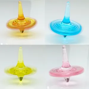 Acrylic crystal spinning top fidget toy in four vibrant colors for the main view.