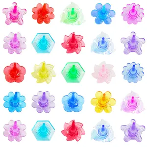 Colorful acrylic crystal finger spinner toy variant with various flower and dolphin shapes.