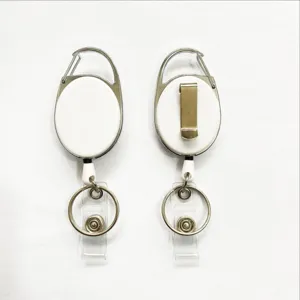 Close-up detail of white retractable badge reel with carabiner, belt clip and split ring.