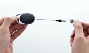 Retractable badge reel with sturdy zinc alloy casing, ideal for ID cards and keys.