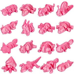 Vista dettagliata di vari giocattoli di animali articolati stampati in 3D rosa, blind box.