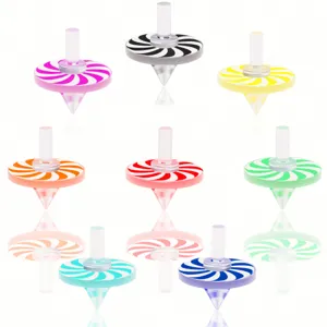 Detailed close-up view of colorful acrylic spinning tops with unique swirl patterns.