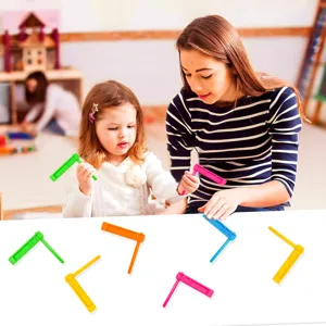 Colorful party hand-cranked noisemaker toys detail view showing vivid colors and interactive use.