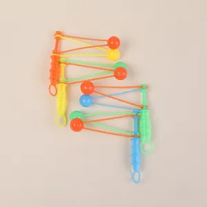 Traditional nostalgic swing hammer toy, colorful plastic clacker ball set close-up detail.