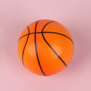 Mini PU foam basketball stress relief toy, textured detail showing soft bouncy material.