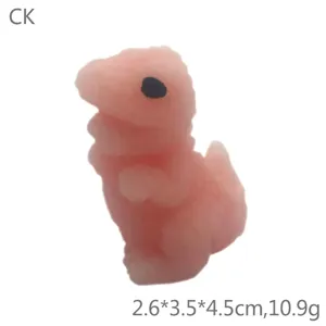 Cute pink dinosaur squishy toy detail view, soft rubber stress relief novelty fidget item.