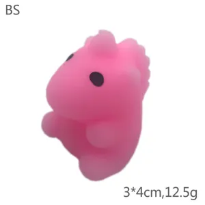 Cute pink dinosaur squishy toy, soft silicone stress relief toy, 3x4cm compact size.