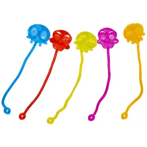 Close-up detail of colorful translucent skull sticky wall toys, featuring five vibrant colors.