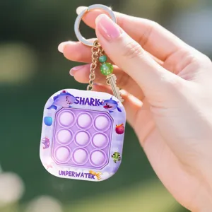 Niedlicher Push Pop Bubble Fidget Spielzeug Schlüsselanhänger mit Haifisch Design, tragbar.