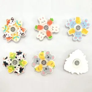 Cute cartoon acrylic fidget spinner with various animal and fruit designs for stress relief.