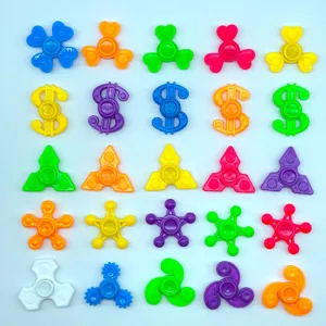 Colorful plastic mini fidget spinners detail view, assorted shapes and vibrant colors.
