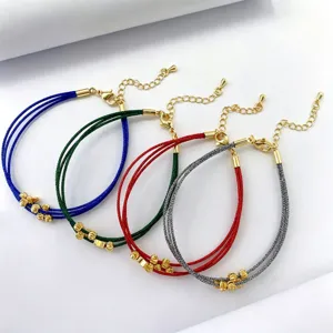Bracciale in corda multicolore intrecciato multistrato fatto a mano con perle dorate.