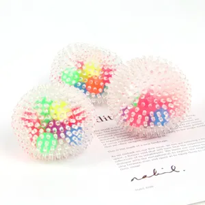 Rainbow spiky stress ball TPR sensory toy for anxiety relief and fun squeezing play.