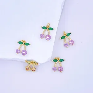 Gold cherry pendant charm with green and pink zirconia stones for DIY jewelry making details.