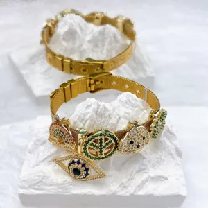 Gold stainless steel mesh strap bracelet with colorful zircon DIY charms and evil eye details.