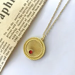 Vintage gold coin pendant necklace with red zircon stone for women stylish jewelry accessory.
