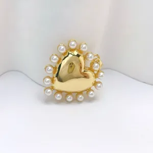 Gold-plated heart pendant with pearl border, delicate DIY jewelry accessory for necklaces.