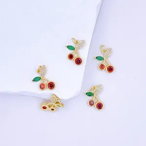 Gold-plated cherry pendant charms with micro-inlaid cubic zirconia stones for DIY jewelry making.