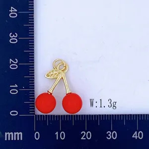 Gold-plated cherry pendant charm with red enamel finish for DIY jewelry making detail view