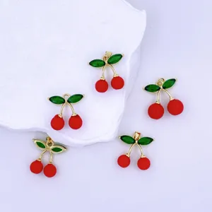 Exquisite red cherry pendant detail, featuring golden stems and green leaves for DIY crafts.
