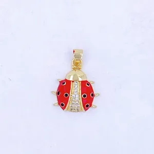 Exquisite ladybug pendant charm with red enamel and sparkling crystal details for DIY crafts.