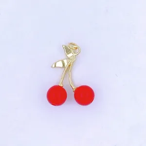 Detail shot of a cute red cherry pendant with gold stem, perfect for DIY jewelry making.