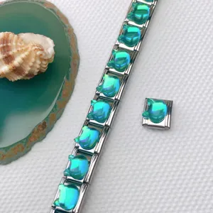 Stainless steel modular Italian charm bracelet with turquoise cat head gemstone DIY links.