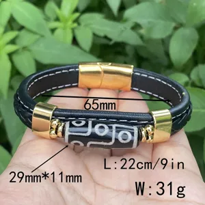 Detail view of a retro men's woven leather bracelet featuring a black band and gold accents.