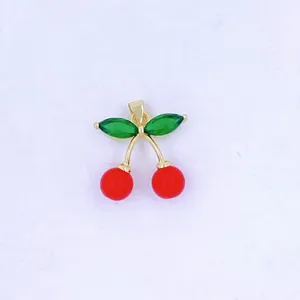 Gold cherry pendant necklace charm with green crystal leaves and red bead fruits detail shot