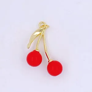 Gold plated cherry pendant detail, red enamel fruit charm for DIY jewelry making and crafts.