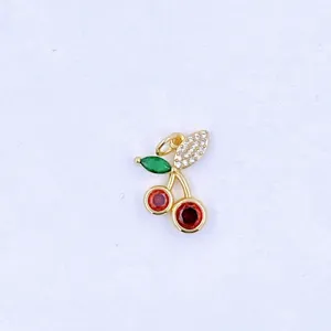 Gold plated cherry pendant with colorful cubic zirconia stones, elegant jewelry accessory.