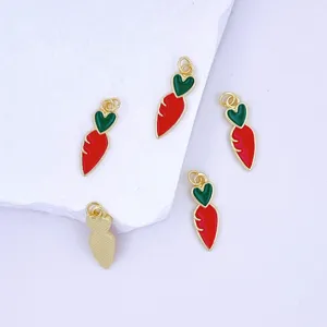 Detailed close-up of cute carrot-shaped enamel charm pendants with gold trim for DIY jewelry making.