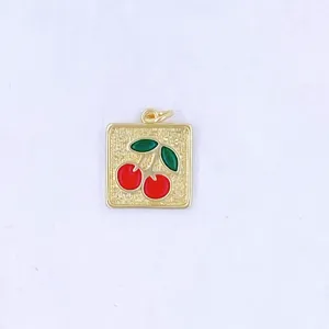 Exquisite cherry pendant detail shot, sweet style red and green enamel gold metal charm.