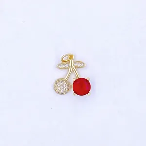 Close up of exquisite cherry pendant with micro zirconia and red gemstone detail jewelry accessory.