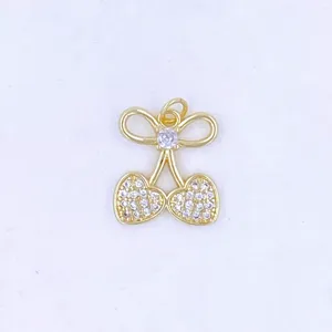 Gold-plated cherry pendant necklace with sparkling zirconia crystals, sweet girlish style jewelry detail.