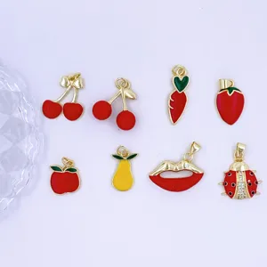 Gold enamel fruit and insect charms set, perfect for DIY jewelry making and keychains.