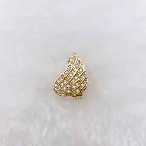 Exquisite golden angel wing charm detail, paved with sparkling cubic zirconia stones for DIY jewelry.