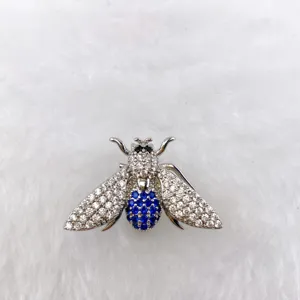 Exquisite silver insect bee brooch detail with sparkling clear and blue crystal stones.