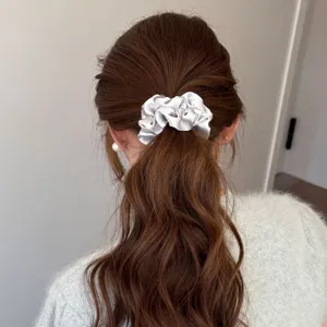 Pearl satin rhinestone scrunchie for women, elegant hair tie for ponytail and bun styling.