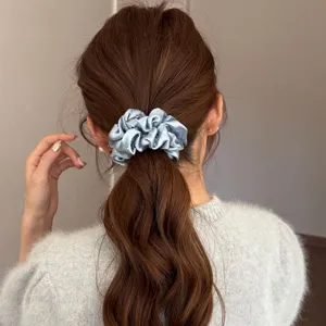 Blue satin scrunchie with delicate rhinestones, elegant hair tie for women ponytail bun.