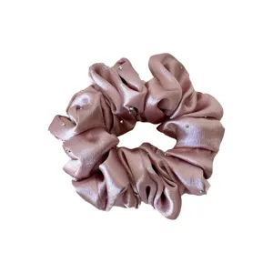 Pink satin hair scrunchie with rhinestone studs, elegant and stylish hair tie for women.